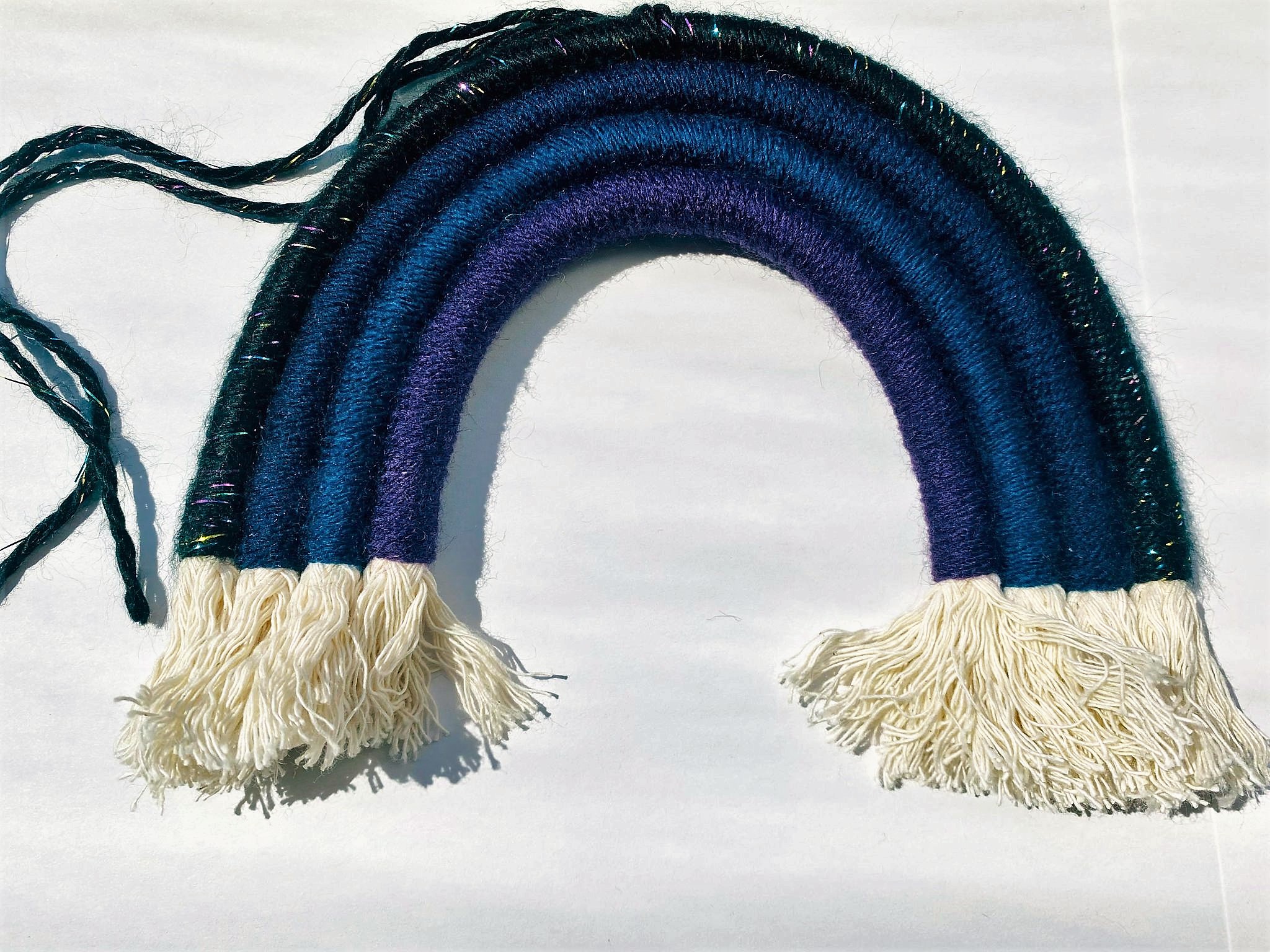 Image of a macramé night rainbow by Thread & Colour