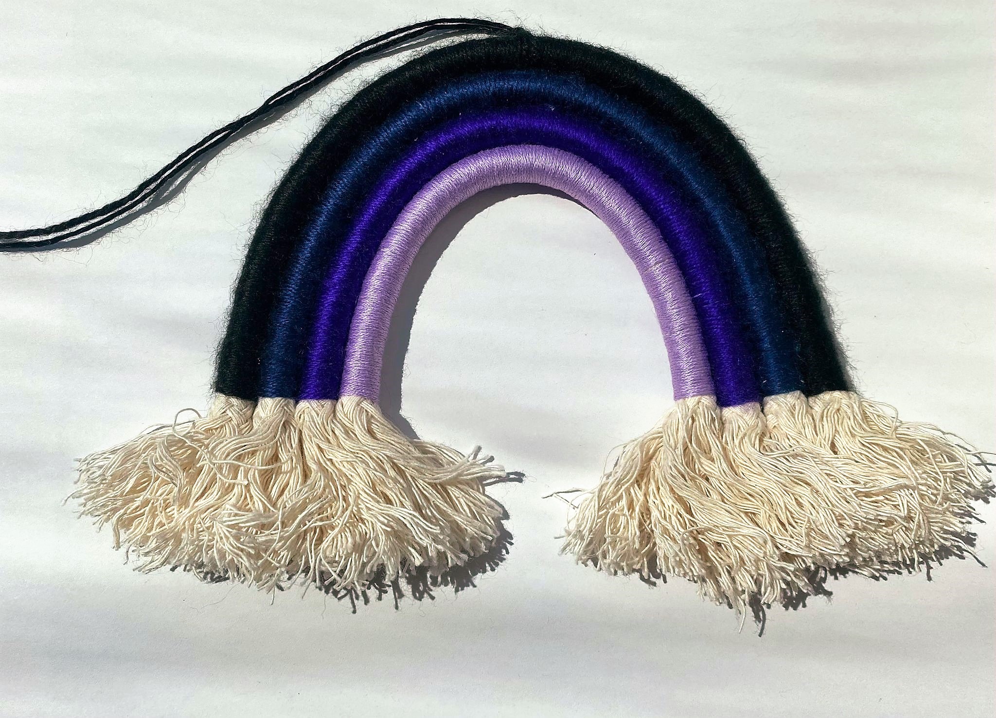 Image of a macramé night rainbow by Thread & Colour