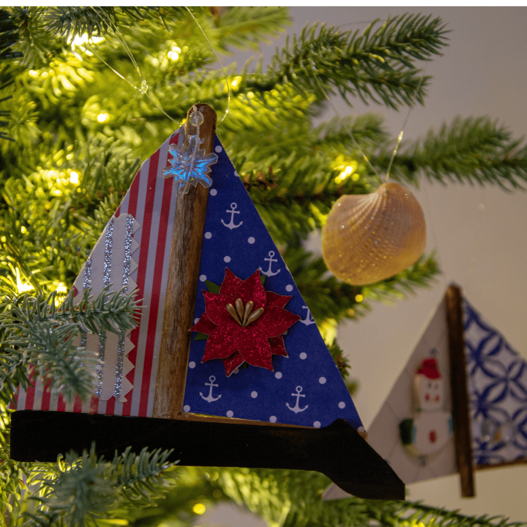 Boat ornament hanging from christmas tree