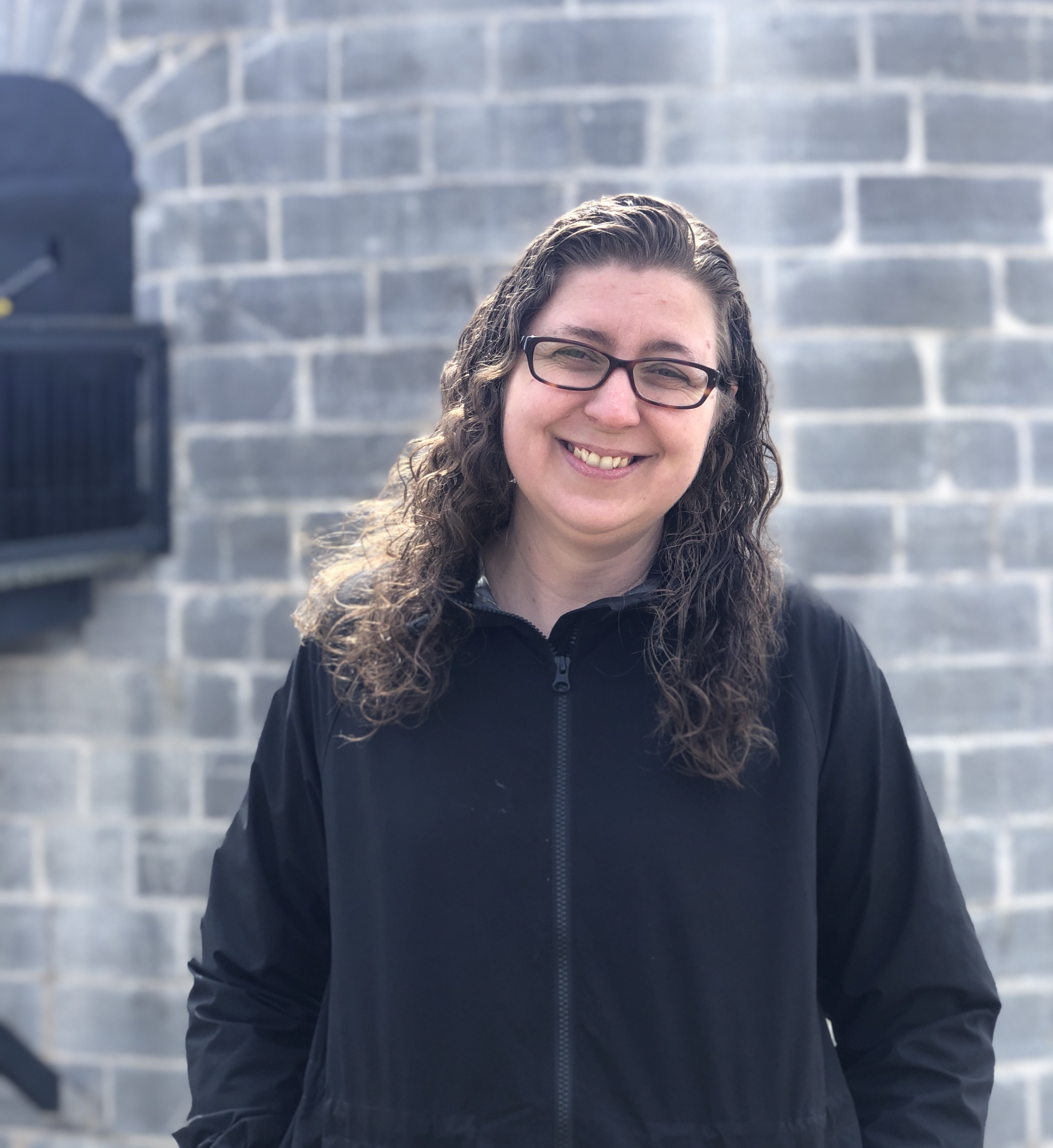 Tabitha Renaud standing in front of Murney Tower Museum